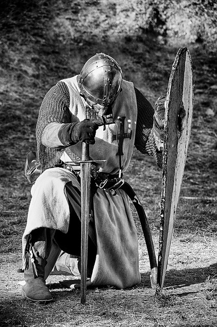 Photo of knight kneeling on the ground